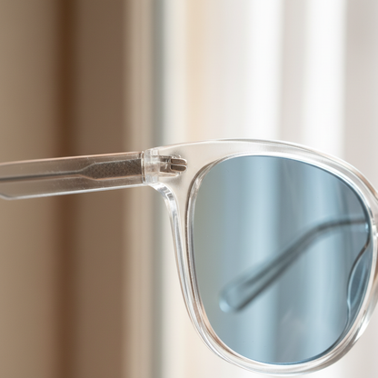 Close-up of transparent frame and ice blue tinted lens